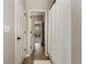 Hallway bathroom featuring tile floors, white doors, and natural light at 1045 Fords Crossing Nw Dr, Acworth, GA 30101