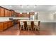 The kitchen is equipped with an island, wooden cabinets, and stainless steel appliances at 1045 Fords Crossing Nw Dr, Acworth, GA 30101