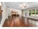 Large open living space with hardwood floors and an open layout to the kitchen at 1045 Fords Crossing Nw Dr, Acworth, GA 30101