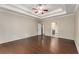 A bright main bedroom features a tray ceiling and hardwood floors at 1045 Fords Crossing Nw Dr, Acworth, GA 30101