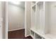Convenient mudroom area with white built-in shelving and coat hooks, perfect for organizing outdoor essentials at 1045 Fords Crossing Nw Dr, Acworth, GA 30101