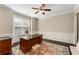 Office room with panel molding, neutral walls, and a dark wood desk at 1045 Fords Crossing Nw Dr, Acworth, GA 30101