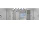 Bright bathroom featuring large mirror, double sinks, glass shower, soaking tub at 1685 Great Oaks Dr, Lawrenceville, GA 30045