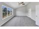 Large bedroom with vaulted ceiling, big windows, and gray carpet at 1685 Great Oaks Dr, Lawrenceville, GA 30045