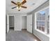 Bright bedroom with a window offering views of the neighborhood and carpeted floor at 1685 Great Oaks Dr, Lawrenceville, GA 30045