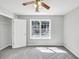 Bright bedroom with a window offering street views and a standard closet door at 1685 Great Oaks Dr, Lawrenceville, GA 30045