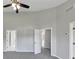 Open bedroom features vaulted ceiling, ceiling fan, gray carpet and neutral walls at 1685 Great Oaks Dr, Lawrenceville, GA 30045