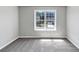 Bedroom with a window offering street views and wall to wall carpet at 1685 Great Oaks Dr, Lawrenceville, GA 30045
