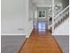 Inviting foyer with hardwood flooring and staircase leading to the second level at 1685 Great Oaks Dr, Lawrenceville, GA 30045
