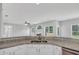 Open-concept kitchen with granite countertops, stainless steel sink, and views of the living area at 1685 Great Oaks Dr, Lawrenceville, GA 30045