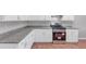 Modern kitchen featuring white cabinets, granite countertops and stainless steel appliances at 1685 Great Oaks Dr, Lawrenceville, GA 30045