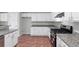 Kitchen showcasing a stainless steel gas range, granite counters, and white cabinetry at 1685 Great Oaks Dr, Lawrenceville, GA 30045