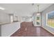 Open-concept living room featuring a walk-out dining area and access to the kitchen at 1685 Great Oaks Dr, Lawrenceville, GA 30045