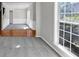 Inviting living room with hardwood flooring and natural light from a large window at 1685 Great Oaks Dr, Lawrenceville, GA 30045