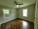 Bedroom with wood floors, two windows and a ceiling fan at 2127 Whites Mill Rd, Decatur, GA 30032