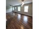 Spacious living room with recessed lights, fan, wood floors and a stylish light fixture at 2127 Whites Mill Rd, Decatur, GA 30032