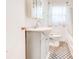 Well-lit bathroom features a charming vanity, patterned floor tiles, and a built-in medicine cabinet at 5136 Jones Rd, Forest Park, GA 30297