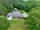 Beautiful home with pool, trampoline, two-car garage and fully fenced backyard nestled among mature trees and a lush green lawn at 955 Chandler Haulk Rd, Loganville, GA 30052