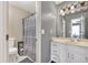 Bathroom featuring a vanity with white cabinets, mirror, decorative lighting, and a shower with curtain at 955 Chandler Haulk Rd, Loganville, GA 30052