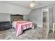 Cozy bedroom featuring a gray accent wall, unique headboard, and an attached closet space at 955 Chandler Haulk Rd, Loganville, GA 30052