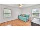 Bright bedroom with a daybed, windows, and hardwood flooring at 955 Chandler Haulk Rd, Loganville, GA 30052