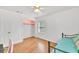Bedroom with daybed, closet, window and hardwood flooring at 955 Chandler Haulk Rd, Loganville, GA 30052