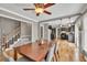 Open-concept dining room with hardwood floors offering a view to the staircase and kitchen at 955 Chandler Haulk Rd, Loganville, GA 30052