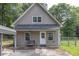Charming single-story home featuring a cozy front porch and well-maintained yard, located in a peaceful, wooded neighborhood at 955 Chandler Haulk Rd, Loganville, GA 30052