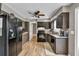 Spacious kitchen with ample cabinet space, modern appliances, hardwood floors, and stylish countertops at 955 Chandler Haulk Rd, Loganville, GA 30052