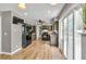 Bright kitchen with hardwood floors, dark appliances, sliding glass doors providing lots of natural light at 955 Chandler Haulk Rd, Loganville, GA 30052