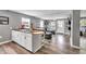 Modern living space with plank floors, open layout, comfortable seating, and a seamless flow into the living room and dining area at 955 Chandler Haulk Rd, Loganville, GA 30052