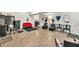 Open salon area featuring chairs, mirrors, a red sofa, and ample space at 955 Chandler Haulk Rd, Loganville, GA 30052