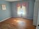 Cozy bedroom with hardwood floors, window and built in closet awaits personal touches at 1275 Bell Ave, Atlanta, GA 30344