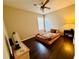 Comfortable bedroom with hardwood floors, one window, and a ceiling fan at 2550 Kentshire Way, Lawrenceville, GA 30044