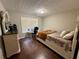 Cozy bedroom with hardwood floors, desk area and textured ceiling at 2550 Kentshire Way, Lawrenceville, GA 30044