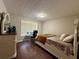 Cozy bedroom with hardwood floors, desk area and textured ceiling at 2550 Kentshire Way, Lawrenceville, GA 30044