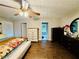 Spacious bedroom with hardwood floors, ceiling fan, and natural light from the window at 2550 Kentshire Way, Lawrenceville, GA 30044