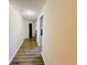 Long hallway featuring hardwood floors and neutral color walls at 2550 Kentshire Way, Lawrenceville, GA 30044
