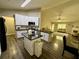Modern kitchen with white cabinets, stainless steel appliances, and dark countertops at 2550 Kentshire Way, Lawrenceville, GA 30044