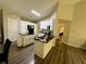 Modern kitchen with white cabinets, stainless steel appliances, and dark countertops at 2550 Kentshire Way, Lawrenceville, GA 30044