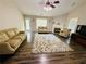 Spacious living room with hardwood floors, fireplace, and large windows at 2550 Kentshire Way, Lawrenceville, GA 30044