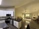 Open concept living room and kitchen featuring cathedral ceilings and plenty of natural light at 2550 Kentshire Way, Lawrenceville, GA 30044