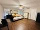 Comfortable main bedroom with hardwood floors, and a ceiling fan at 2550 Kentshire Way, Lawrenceville, GA 30044