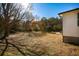 Spacious backyard featuring mature trees and green grass, offering a serene outdoor space at 272 Old Sudie Rd, Hiram, GA 30141