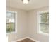 This bedroom has new vinyl floors and large windows at 272 Old Sudie Rd, Hiram, GA 30141