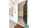 Open entryway with a glimpse of the modern interior, showcasing the door, and hardwood floors at 272 Old Sudie Rd, Hiram, GA 30141