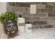 Kitchen counter with coffee and sugar containers next to a houseplant and a 'Coffee Break' sign at 272 Old Sudie Rd, Hiram, GA 30141