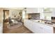 Bright kitchen with white cabinets, modern backsplash, and hardwood floors at 272 Old Sudie Rd, Hiram, GA 30141