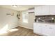 Charming kitchen with white cabinets, granite countertops, and natural light at 272 Old Sudie Rd, Hiram, GA 30141