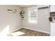 Bright kitchen features white shelves decorated with houseplants and other homey decor items at 272 Old Sudie Rd, Hiram, GA 30141
